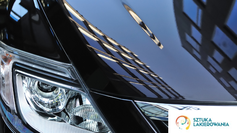 usługi lakiernicze Warszawa, SztukaLakierowania - lakierowanie samochcodu efekty, czyli pięknie lśniące słońce na czarnym lakierze na masce samochodu